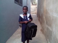 young girl in Ghana on her way to school